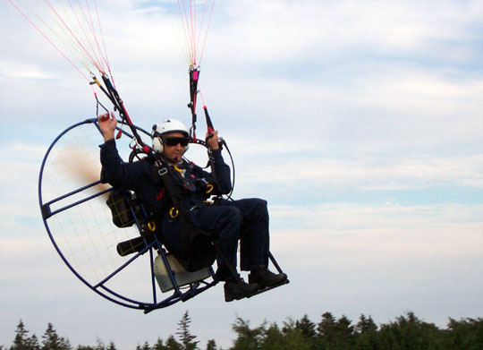 Ted D'Eon paramotoring over West Pubnico - Milton D'Eon photo - July 30, 2003
